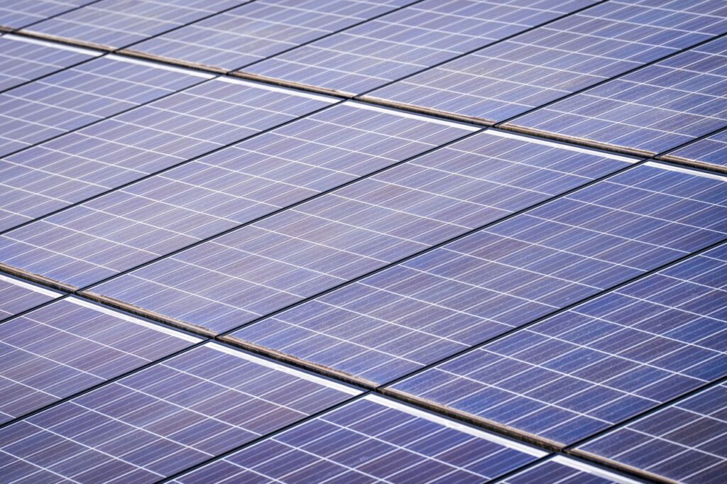 Close-up of a solar panel array capturing renewable energy on a sunny day.